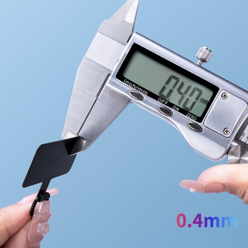 A digital calliper reading 0.40 mm on the Y143 stainless steel tether tab
