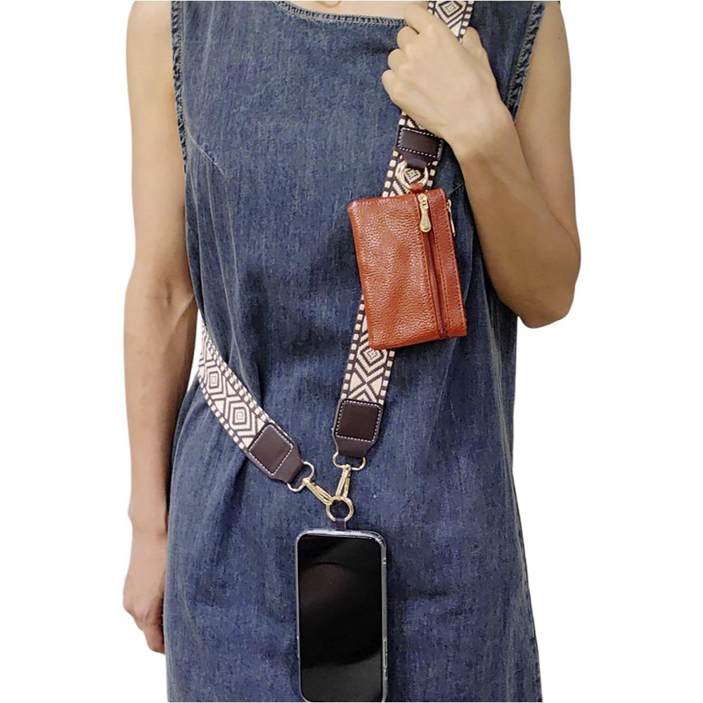 Y329 woven lanyard strap worn cross-body by a model, with the matching zip pouch on the strap and a phone hanging from the clip