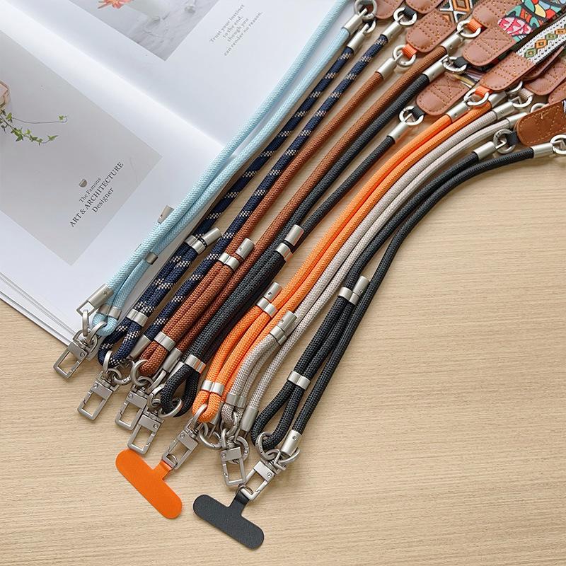 Six Y026 colourways lined up: solid braided cords with leather patches and metal connectors