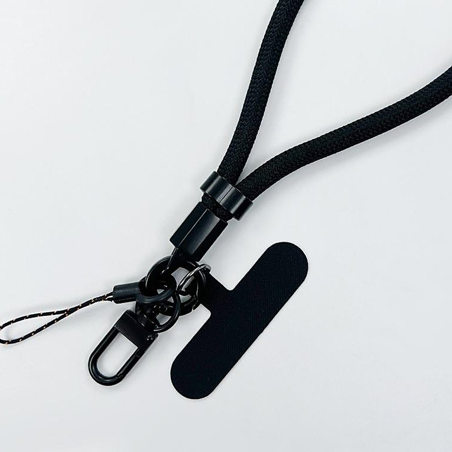 Close-up of the matte black alloy slider buckle, split ring, swivel hook and T-patch